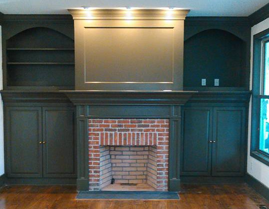 Interior renovation built in shelves and fireplace